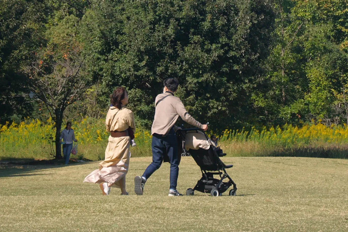 Parents pushing a stroller